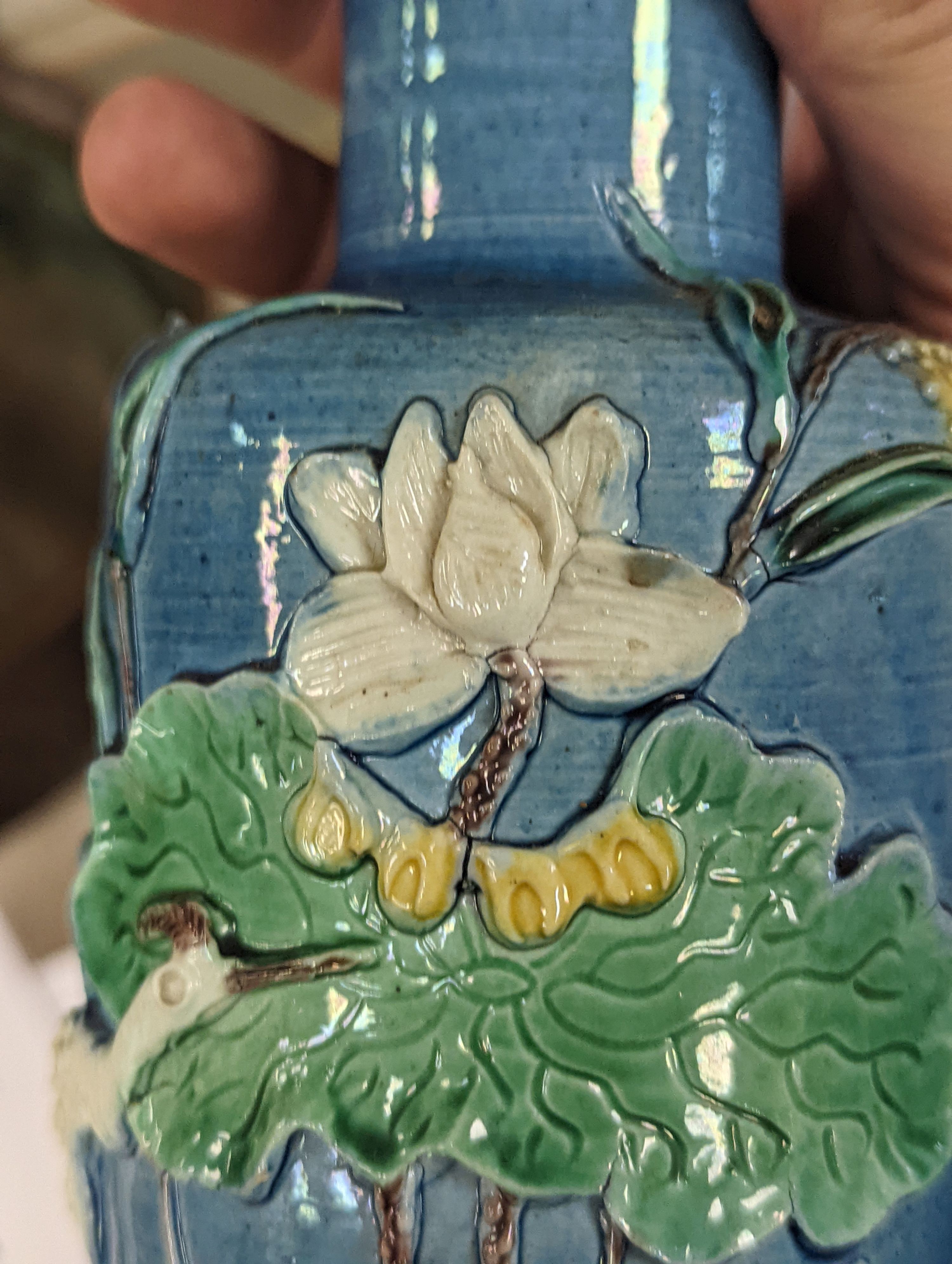 An early 20th century Chinese blue and white lidded vase together with a similar enamelled pottery vase and a Japanese blue and white dish. Tallest vase 29cm